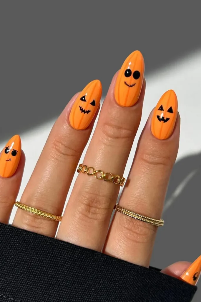 28. Yellow Glossy Pumpkin Nails